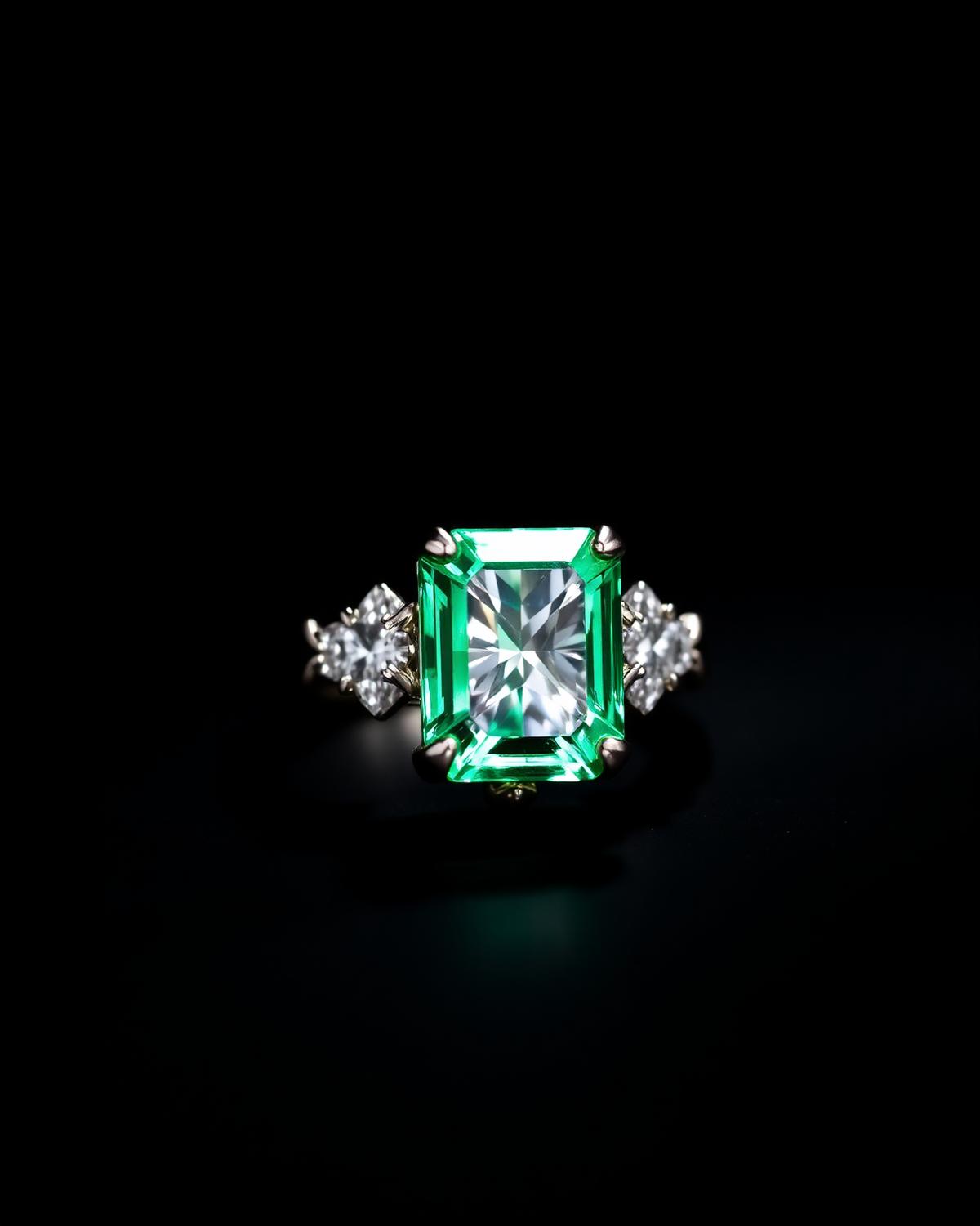 Emerald and diamond cocktail ring on black
